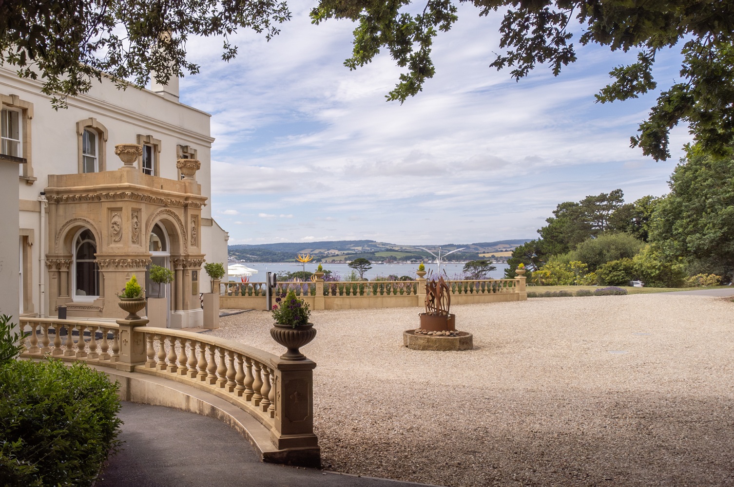 View of Lympstone Manor Hotel with Exe estuary in the background