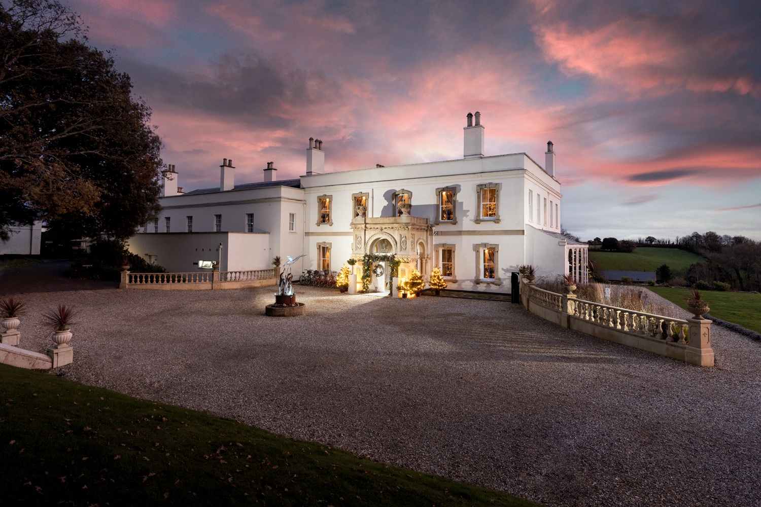 Lympstone Manor Hotel at Christmas with Christmas decorations and wintery sky