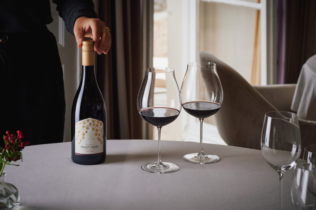 Lympstone Manor Triassic Pinot Noir served in two wine glasses with Christmas decoration