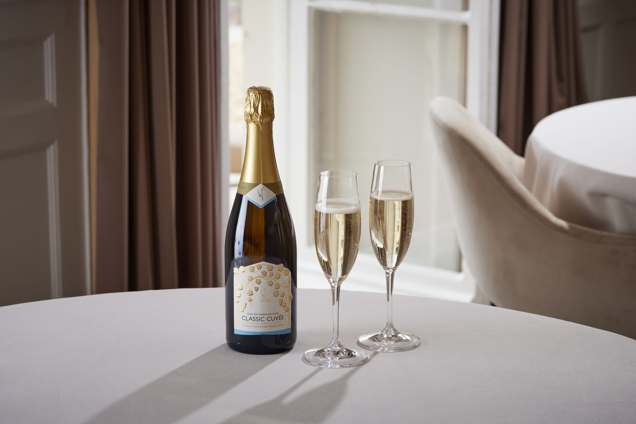 Lympstone Manor Estate Classic Cuvee with two glasses of cuvee in the fine dining restaurant